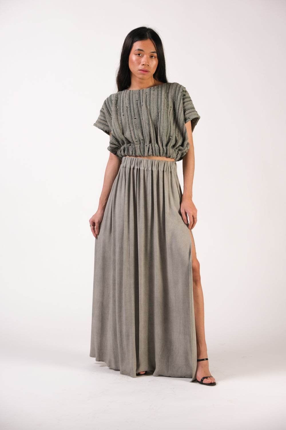 Srey cinch top in sage paired with tonlé's zero waste maxi skirt with side slit, also in sage
