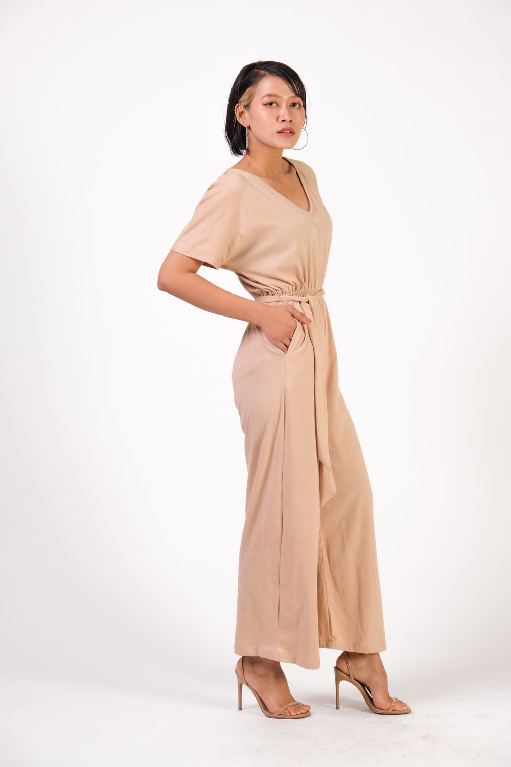 Side view of the tola jumpsuit in natural dyed palm jersey