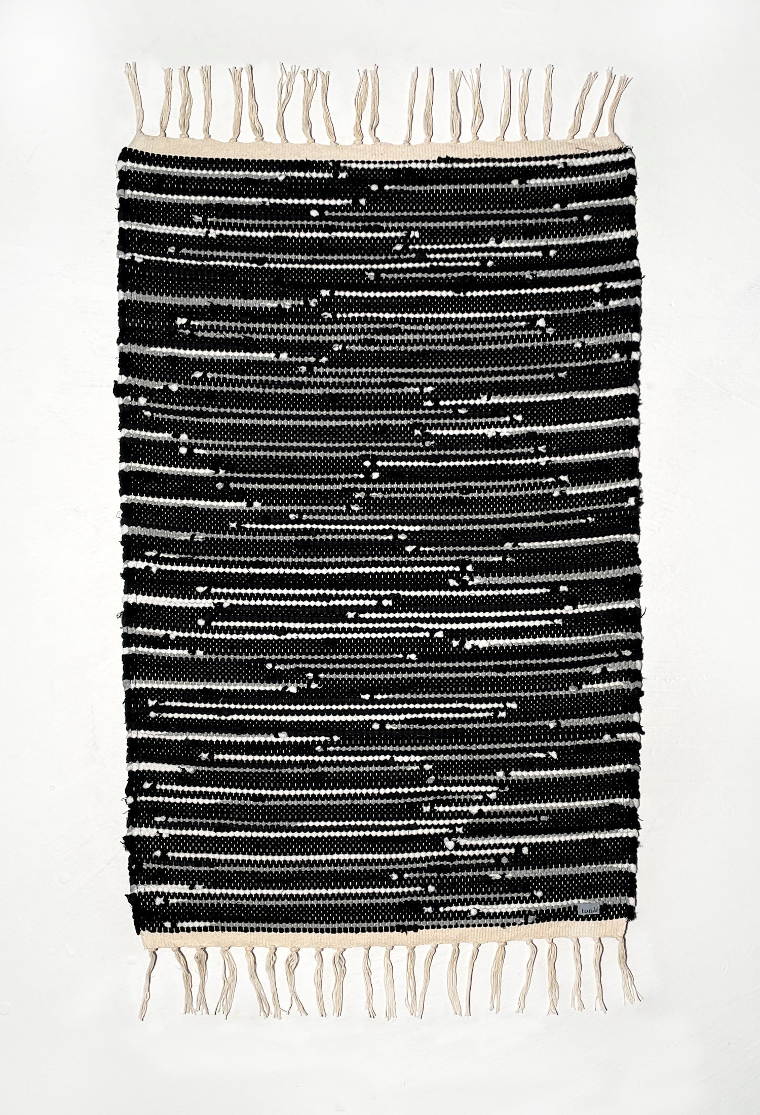 nimol handwoven rug with ties - black and white tones