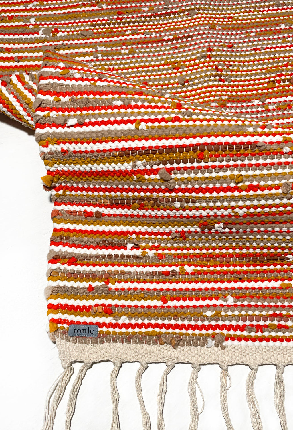 nimol handwoven rug with ties - crimson tones