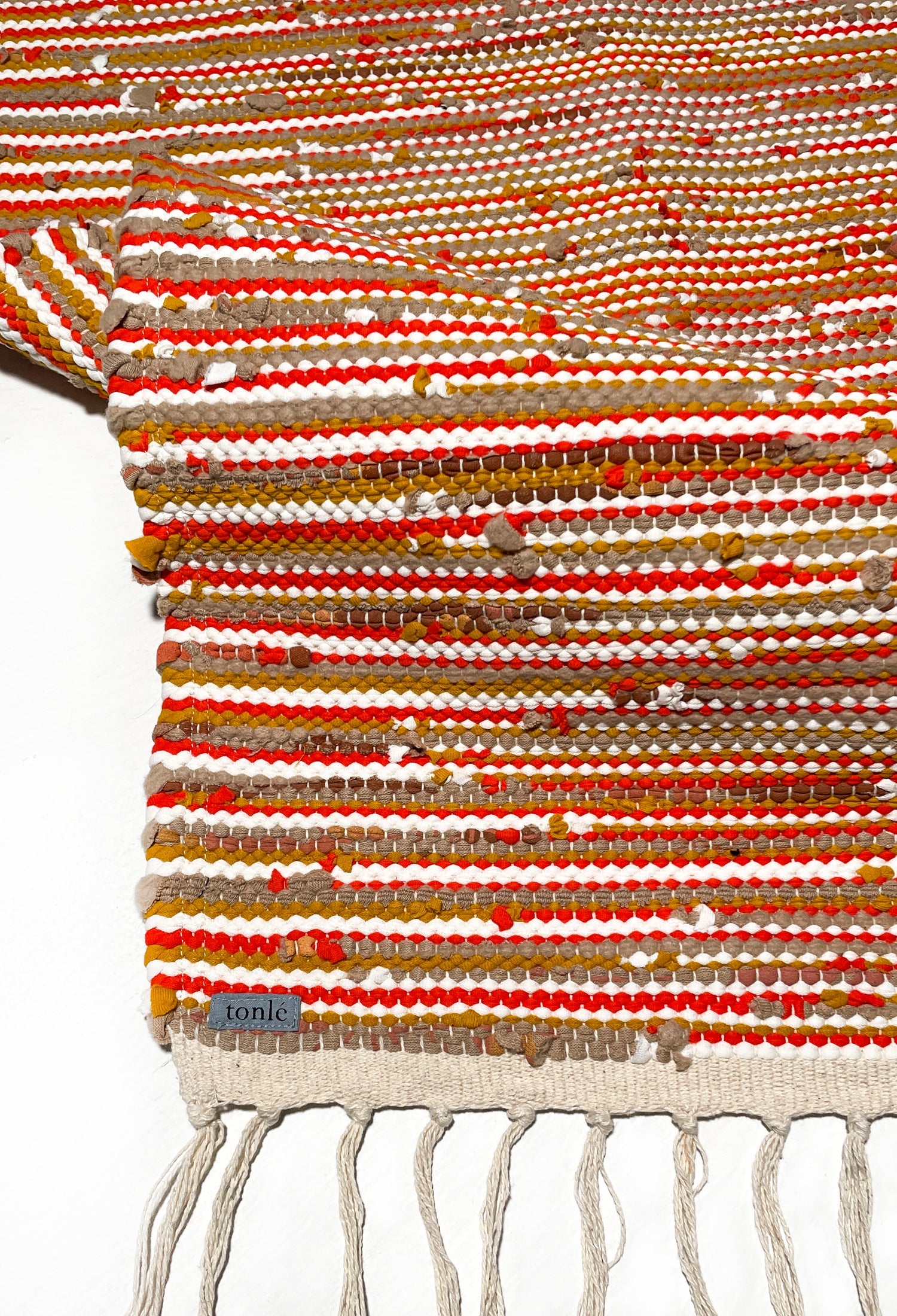 nimol handwoven rug with ties - crimson tones