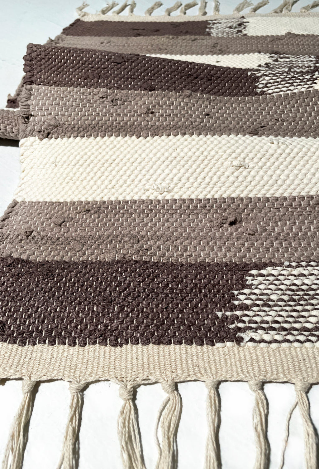 nimol handwoven rug with ties - natural tones