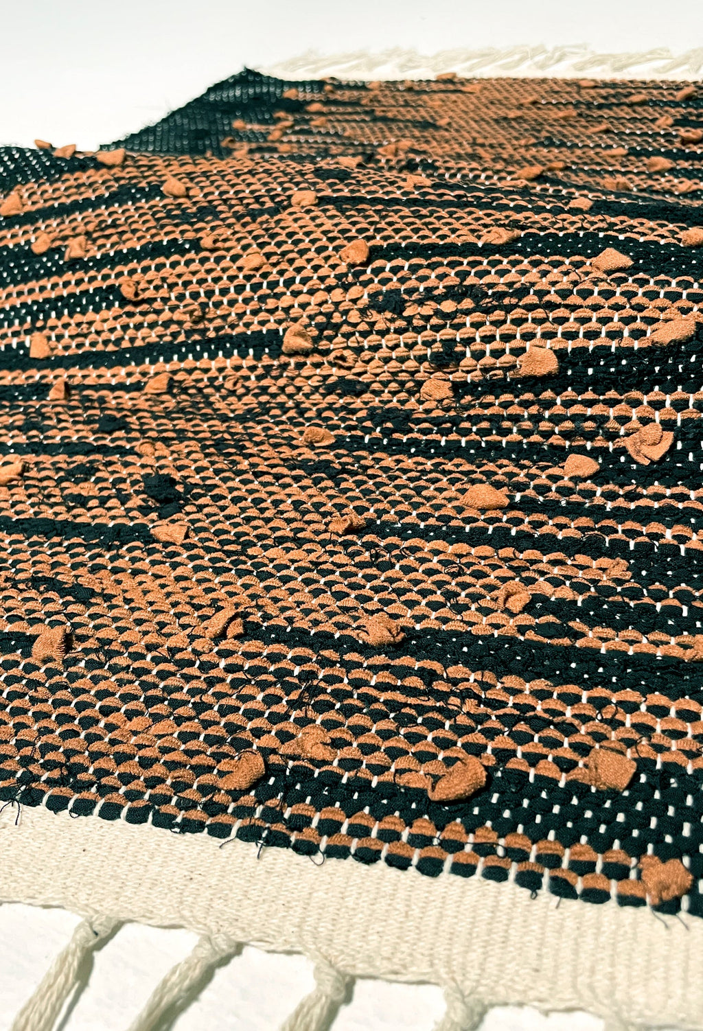 nimol handwoven rug with ties - black and white tones