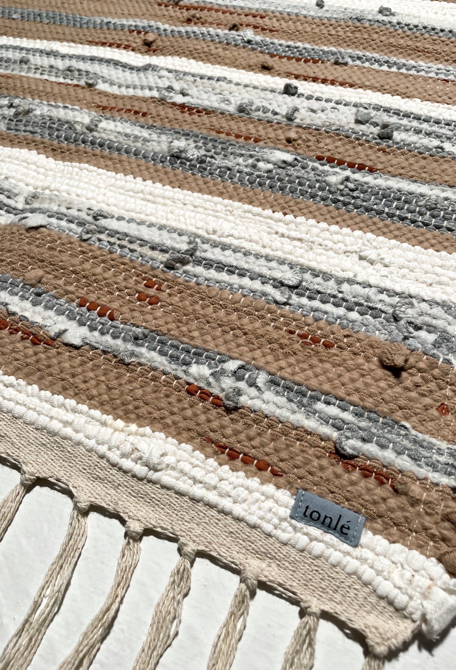 nimol handwoven rug with ties - natural tones