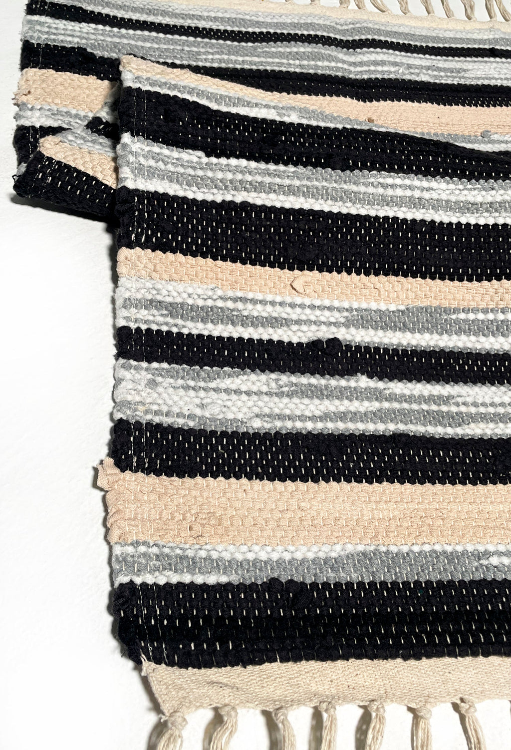 nimol handwoven rug with ties - black and white tones