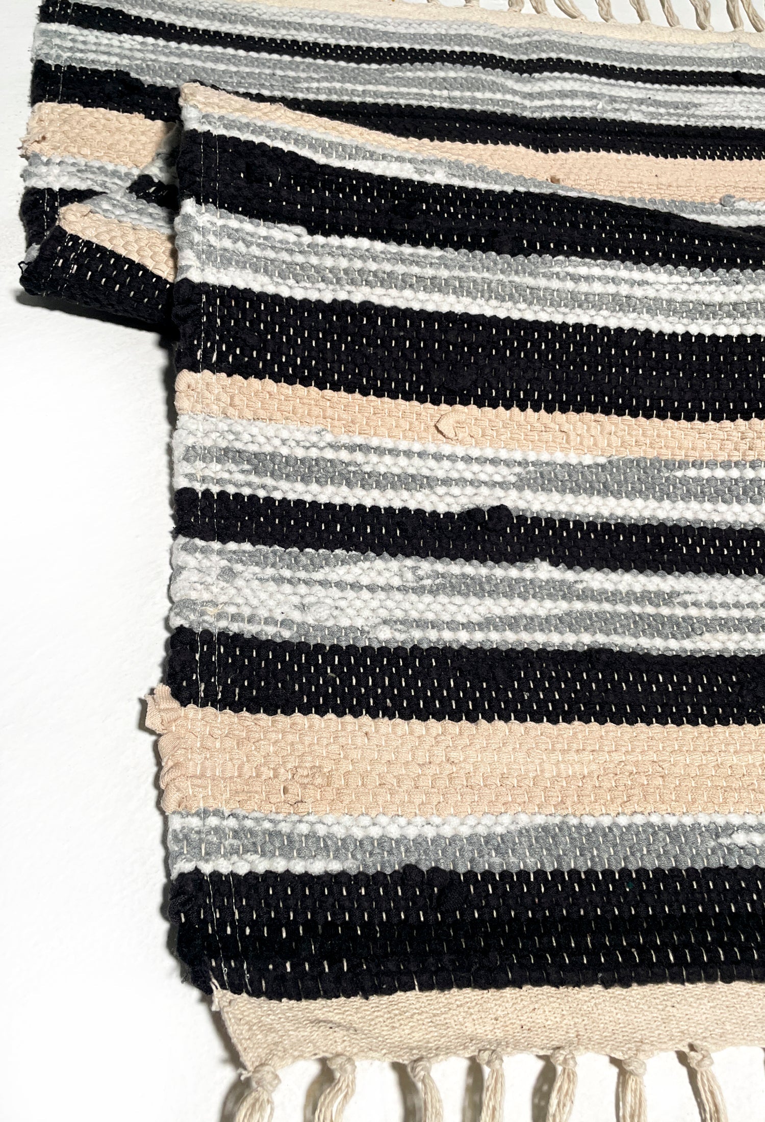 nimol handwoven rug with ties - black and white tones