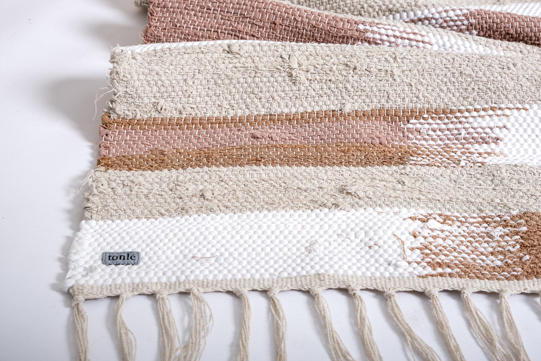 nimol handwoven rug with ties - natural tones