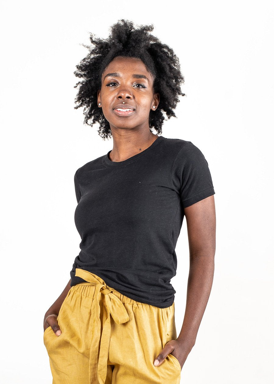 Our classic t-shirt, seen here in black, is made from reclaimed jersey as part of our unique zero waste process.