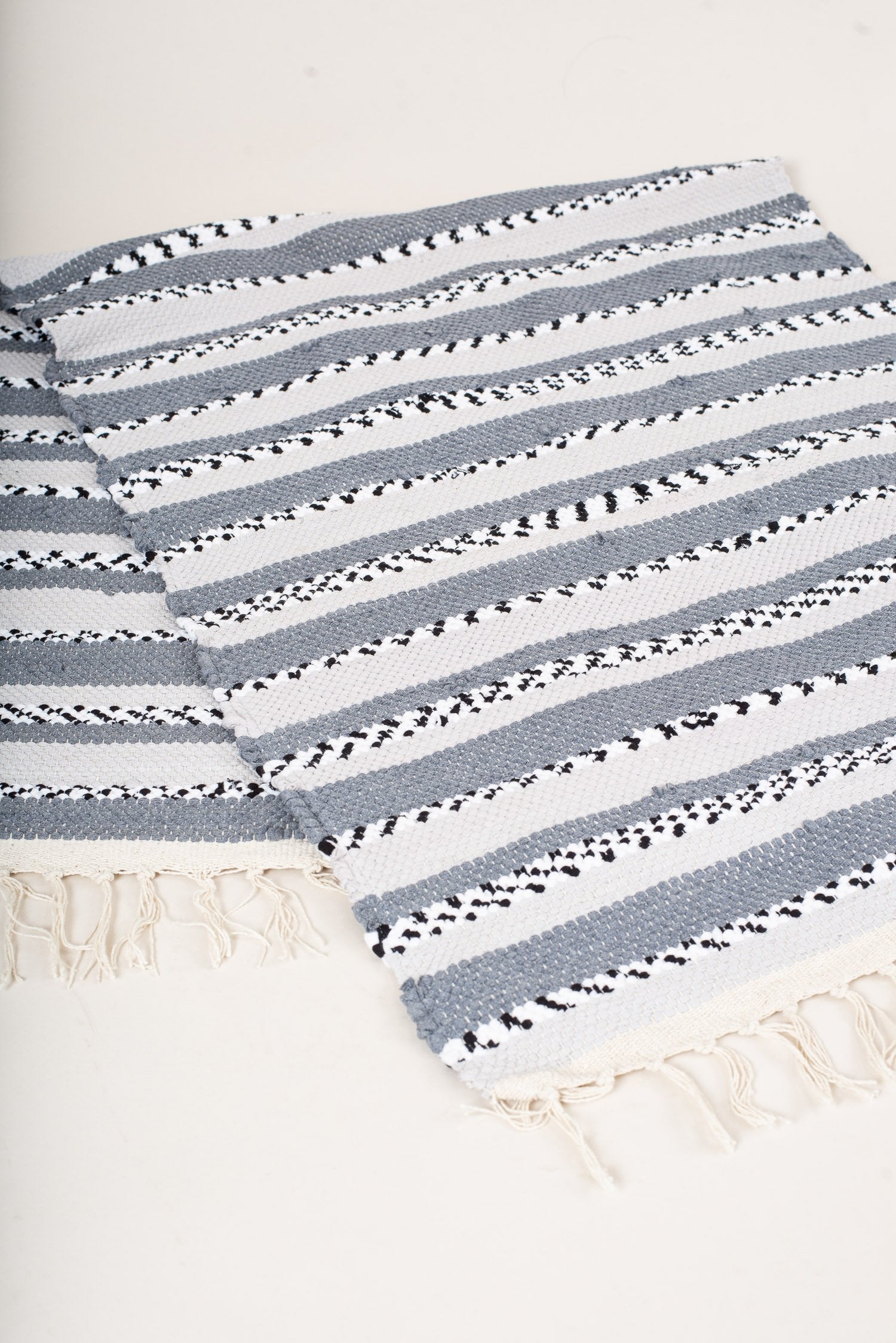 nimol handwoven rug with ties - black and white tones