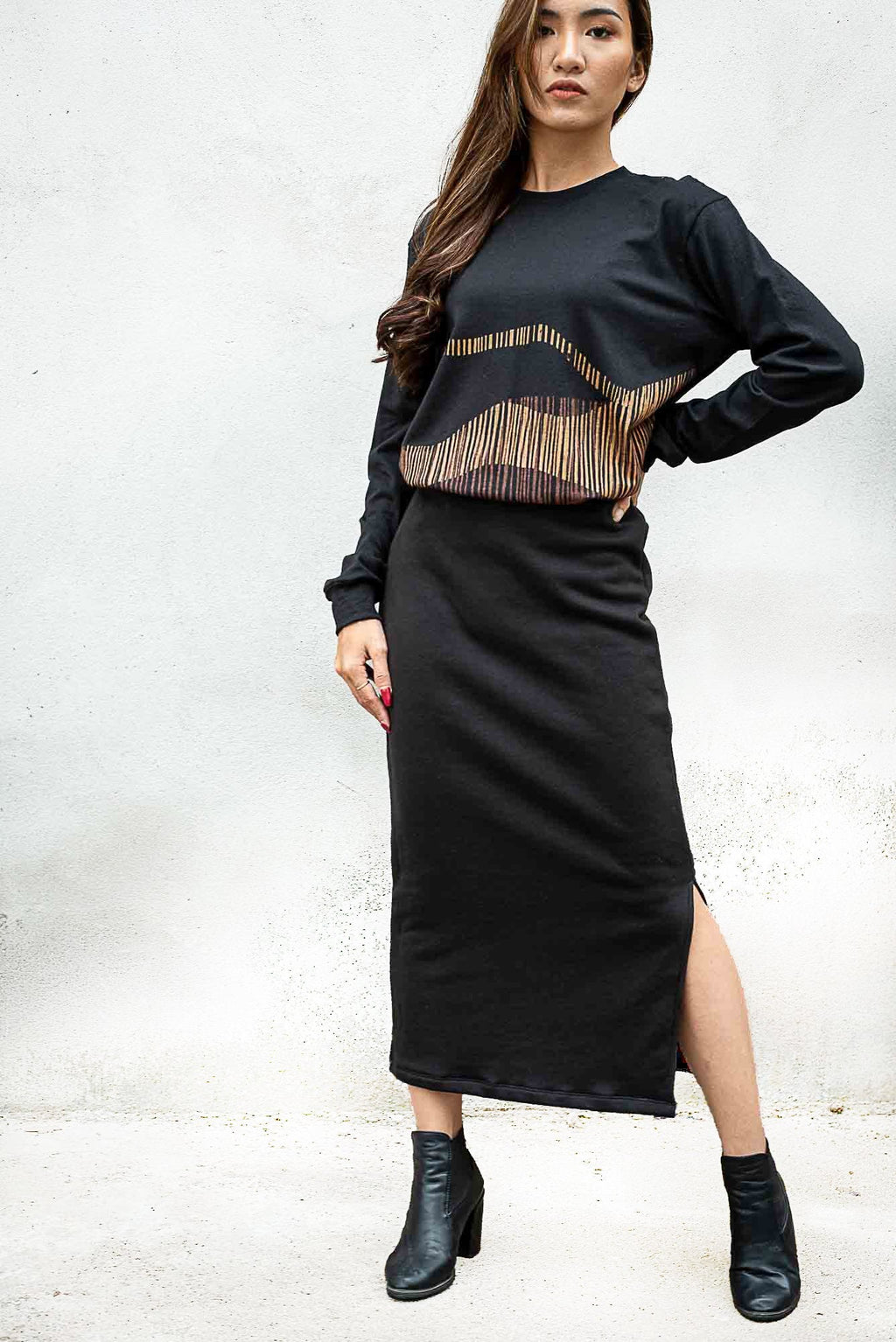 This image of our Jorani skirt in black shows the side slit that makes movement easy.