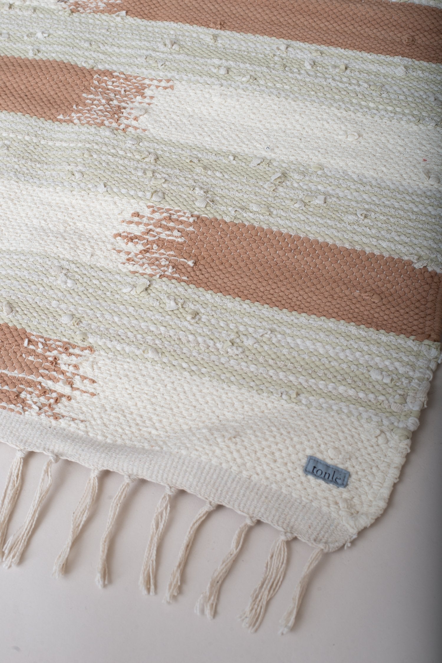 nimol handwoven rug with ties - natural tones
