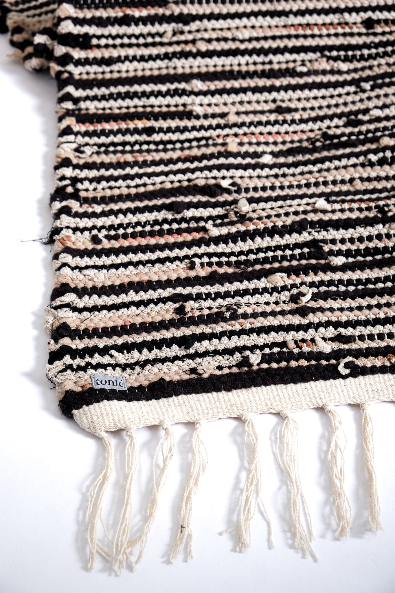 nimol handwoven rug with ties - black and white tones