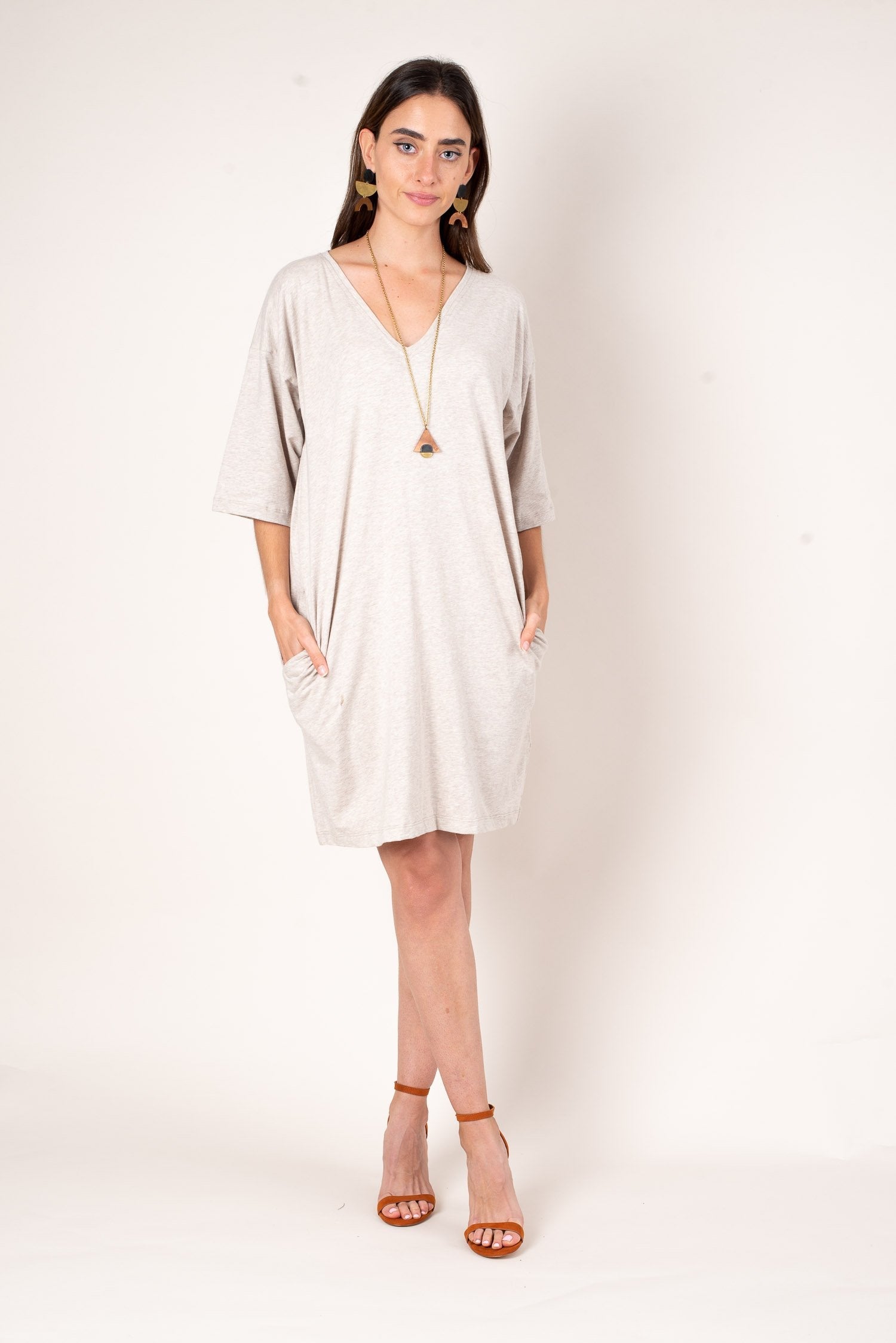 A front view of the oatmeal colored veha t-shirt style dress. Ethically made from reclaimed jersey in our zero waste process.
