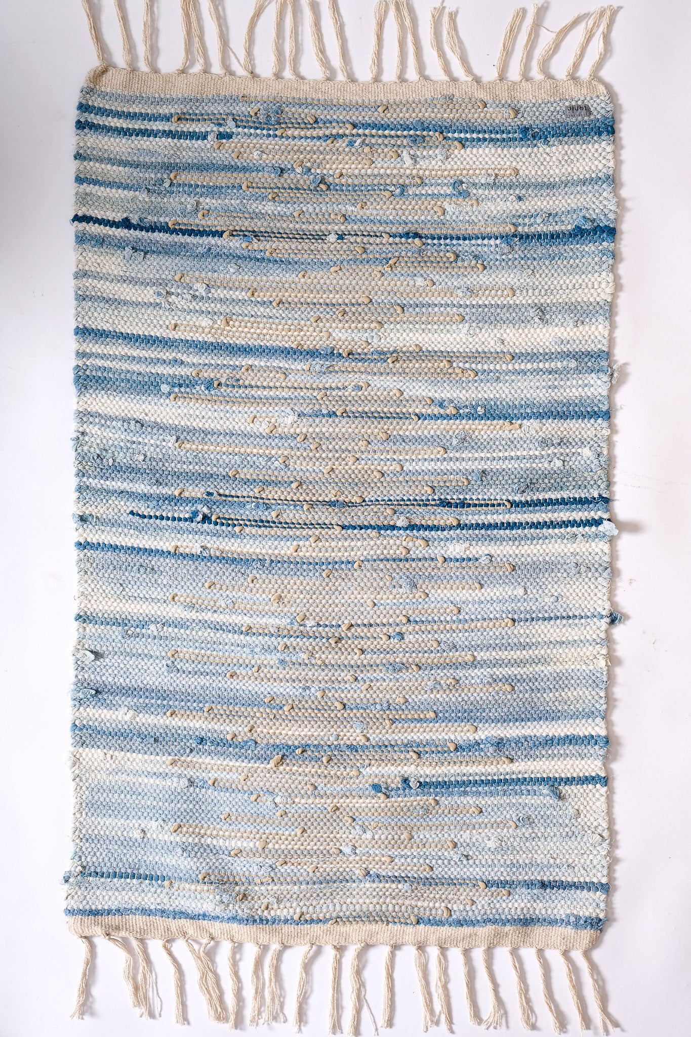 nimol handwoven rug with ties - navy and blue tones