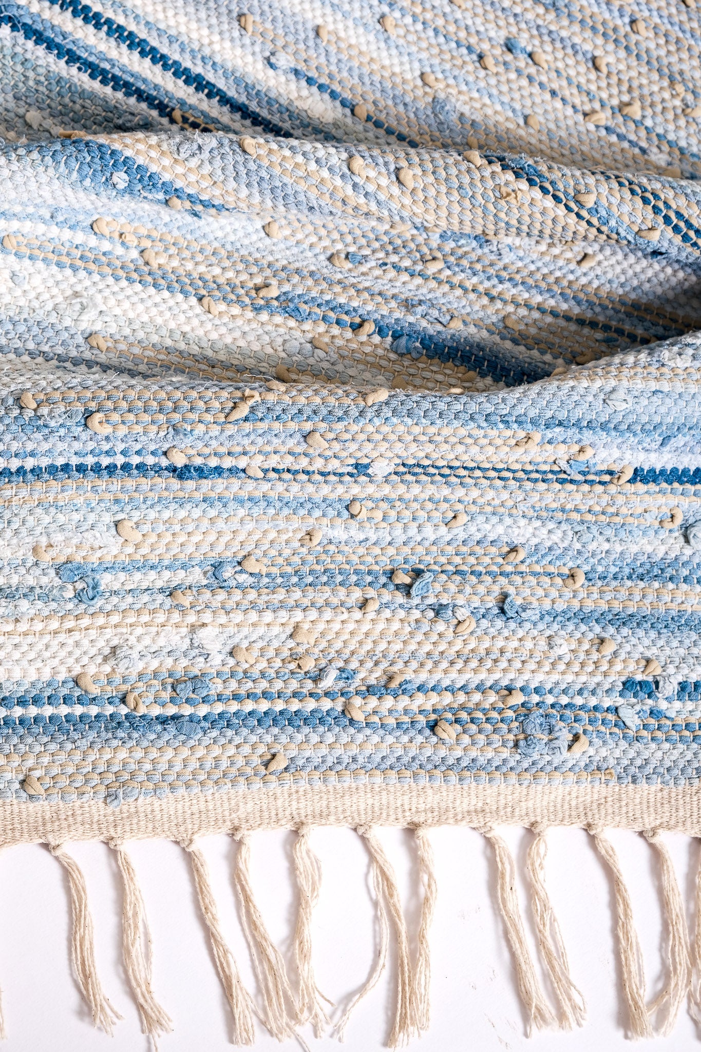 nimol handwoven rug with ties - navy and blue tones